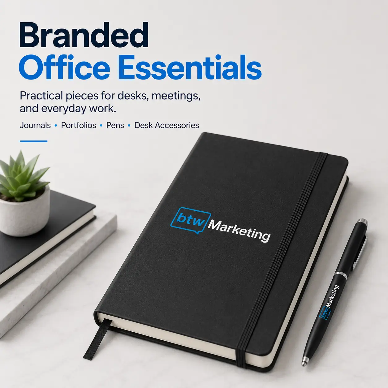 Branded black journal and pen featuring the BTW Marketing logo